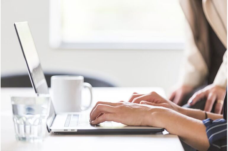business-hands-laptop-office